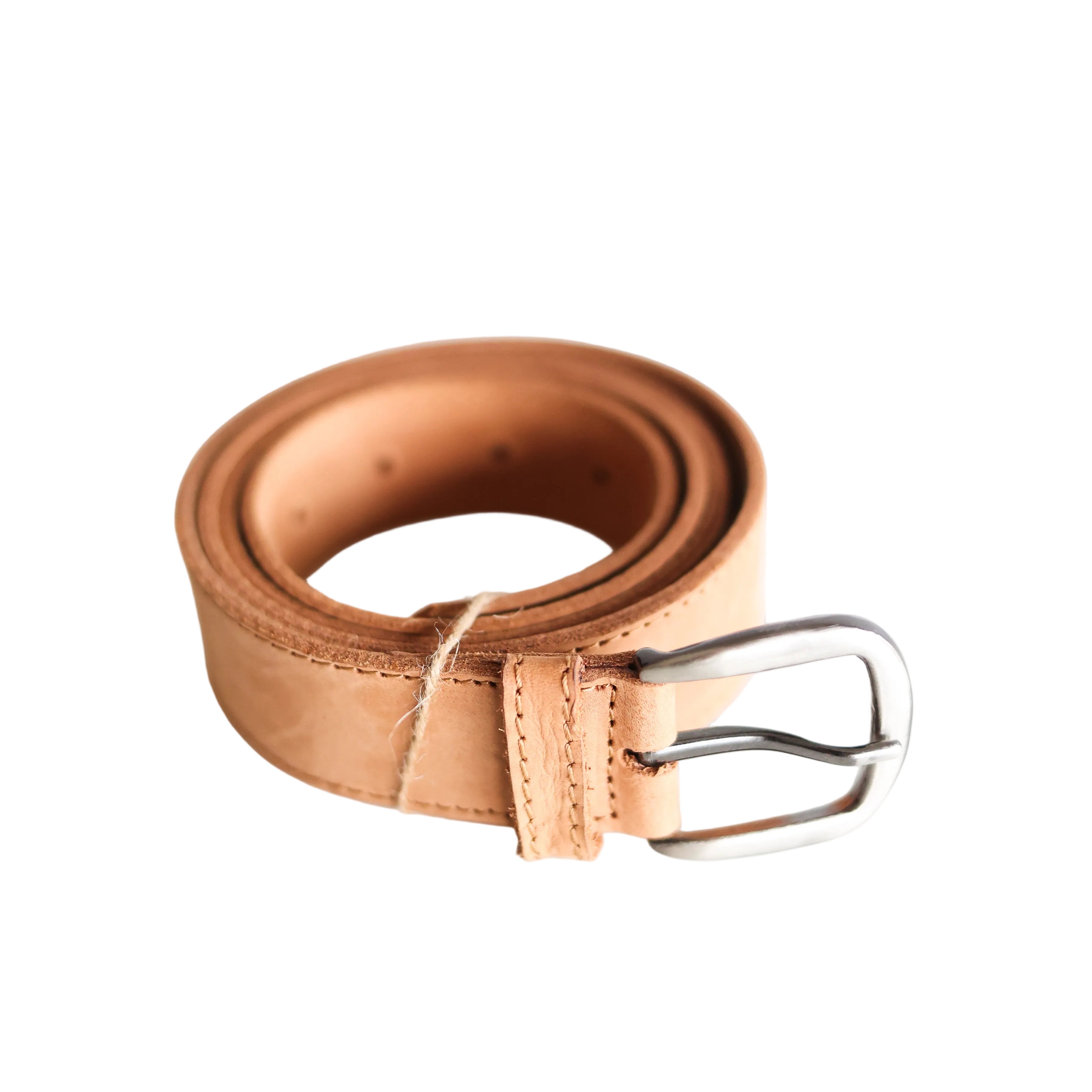 Tan leather belt with silver buckle on a light gray background