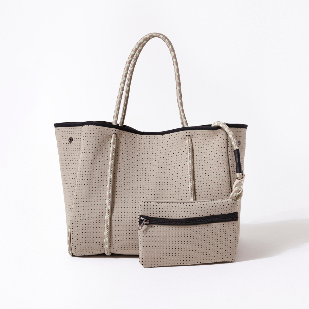 Beige tote bag with rope handle on a white background