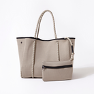 Beige tote bag with rope handle on a white background