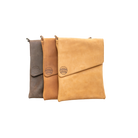 Three leather bags in brown, tan, and beige on a white background