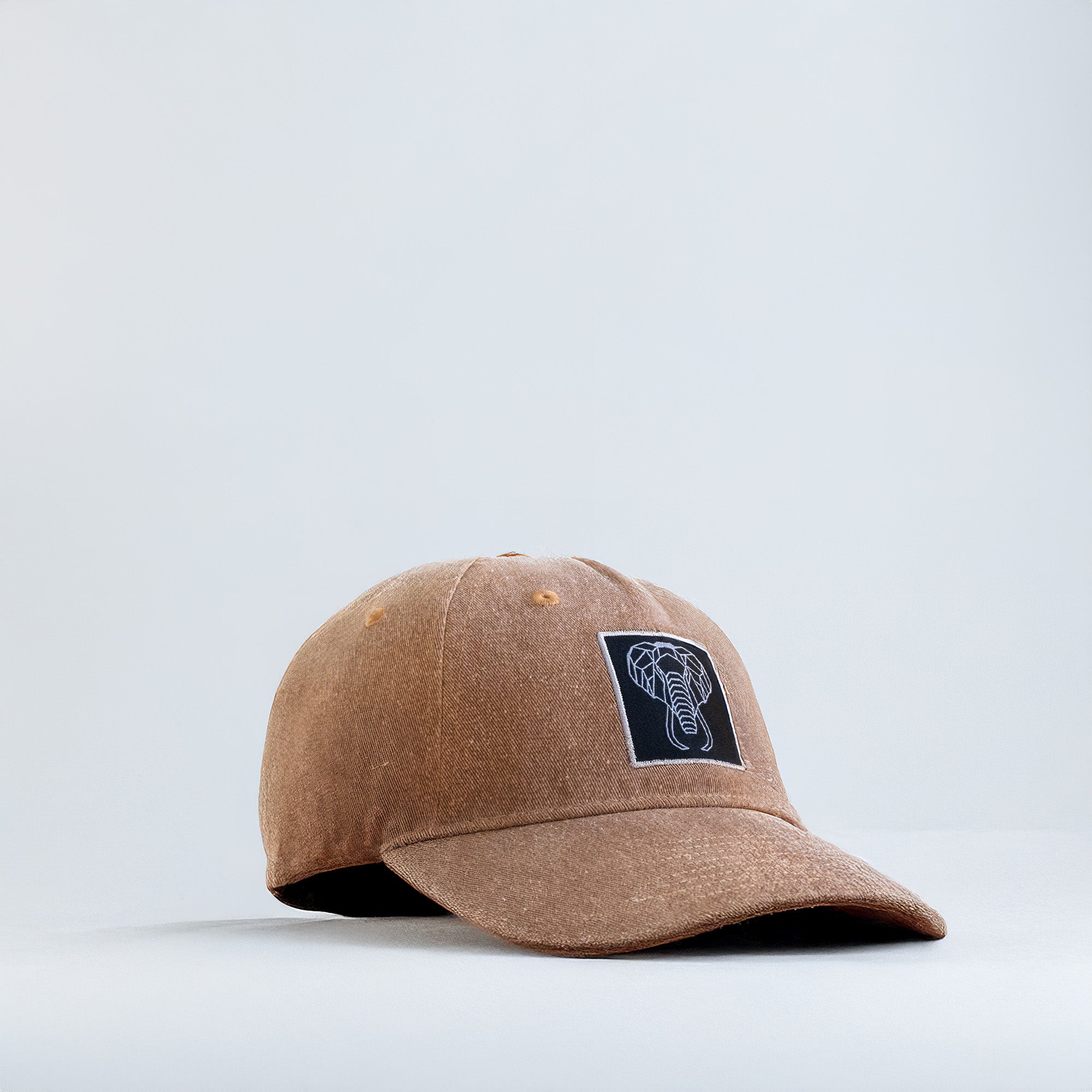 Brown cap with a logo on a light gray background