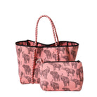 Pink tote bag with elephant pattern and matching pouch on a light gray background