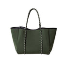 Green handbag with black accents on a white background