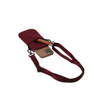 Maroon phone case with a strap on a white background