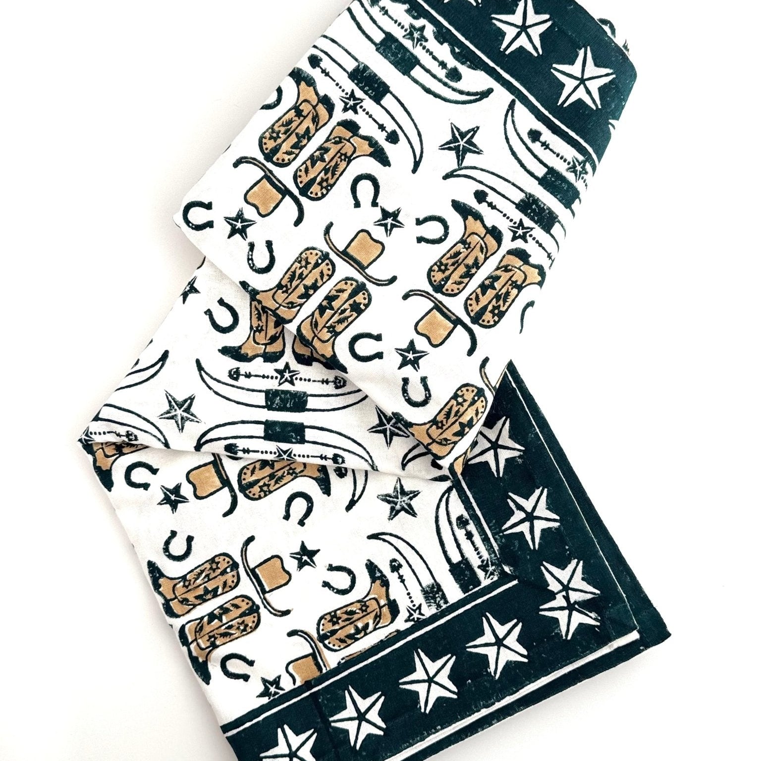 Towel with cowboy boot and star pattern on a white background